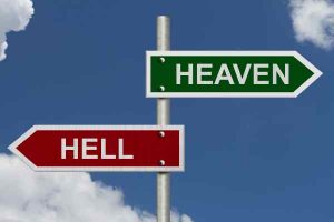 Red and green street signs with blue sky with words Heaven and Hell, Heaven versus Hell